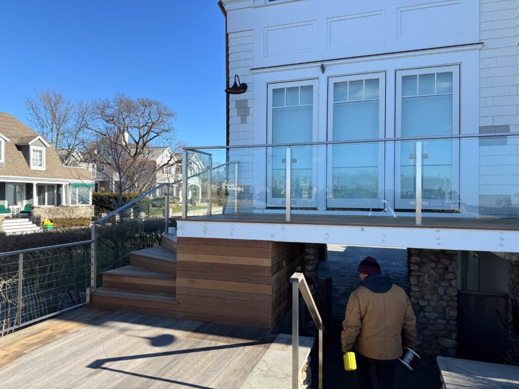 Modern and transparent glass railing, seamlessly integrated into the architectural design.
